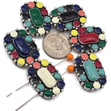 Create eye catching jewelry with these colorful western style two hole slider beads. The detailed metal setting surrounds vibrant enamel accents and a raised center stone design, giving these beads a bold southwestern look. Perfect for double strand bracelet projects using leather cord, beading wire, or thread. Popular for cowgirl jewelry, boho western bracelets, southwestern accessories, and colorful handmade jewelry designs.