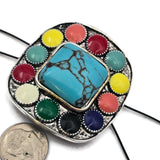 Make a bold statement in your jewelry designs with this large 43 mm western style focal slider bead. Featuring a turquoise style center stone surrounded by vibrant enamel accents, this oversized bead creates a striking centerpiece for handmade jewelry. Designed with two holes for double strand bracelets or necklaces, it pairs beautifully with leather cord, seed beads, gemstone beads, and spacer beads. Perfect for western jewelry, cowgirl accessories, and southwestern statement designs.