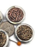 Create eye catching jewelry with these ornate metal floral focal beads. The detailed flower motif and mixed metal finish create a bold centerpiece for bracelets and necklaces. Designed with two holes for double strand jewelry designs, they work beautifully with leather cord, seed beads, gemstone beads, and metal spacers. A wonderful bead choice for western jewelry, boho designs, southwestern accessories, and rustic handmade jewelry.