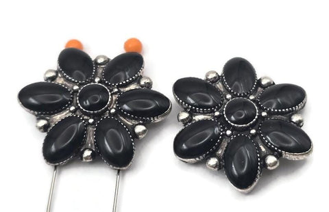 Add bold western style to your jewelry designs with these black floral two hole slider beads. Featuring a petal shaped flower design with smooth black accents set in antique silver tone metal, these beads create a striking focal piece. The two hole construction is perfect for double strand bracelets and necklaces using leather cord, seed beads, or gemstone beads. Ideal for western jewelry, cowgirl accessories, and statement handmade designs.