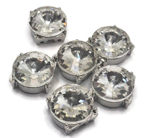 Create dazzling jewelry with these large rhinestone slider beads in a platinum silver setting. Designed with two holes for double strand bracelets and necklaces, these beads feature brilliant faceted crystals that reflect light beautifully. Perfect for pairing with seed beads, duo beads, or glass beads, they add bold sparkle and elegance to jewelry making designs for weddings, events, or statement accessories.