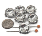These metal 2 hole slider beads feature brilliant faceted rhinestones set in a polished platinum silver finish. Their large size makes them ideal as focal beads in bracelet and necklace jewelry making. Pair with seed beads, duo beads, or spacer beads to create bold, eye-catching designs with a modern, glamorous, or bridal style that adds sparkle and dimension.