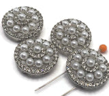 These pearl and rhinestone slider beads in a silver tone finish offer a beautiful layered circular design with shimmering details. Perfect for double strand bracelets and necklace jewelry making, they add dimension and elegance. Pair with seed beads, duo beads, or glass beads to create sophisticated designs ideal for weddings, special occasions, or everyday jewelry with a polished, upscale feel.