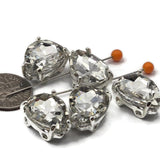 Double hole cut glass crystal beads in a classic teardrop shape with silver prong setting. Ideal spacer beads for bridal jewelry making, earrings, and custom veils. Use in bead weaving, stringing, and wire wrapping projects alongside Duo and CzechMates beads.