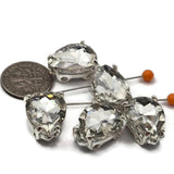 Clear crystal teardrop double hole beads with platinum silver prong setting. These unique slider beads are perfect for bridal bead weaving, peyote stitch, and wire wrapping. A stunning focal bead for necklaces, bracelets, and earrings. Compatible with Duo and CzechMates 2 hole bead systems.