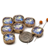 These AB coating rhinestone square 2 hole slider beads flash pink, blue, purple, and gold in changing light. Stunning unique findings in gold bezel setting for bohemian and vintage jewelry designs. Use in bead weaving, peyote stitch, and wire wrapping. Compatible with SuperDuo, CzechMates, and two hole bead systems.