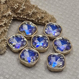 These iridescent AB rhinestone 2 hole slider beads feature faceted cut glass in a full gold bezel setting. Gorgeous unique findings for bohemian jewelry, vintage-inspired designs, and statement pieces. Perfect for wire wrapping, stringing, and bead weaving alongside SuperDuo, CzechMates, and other double hole bead components.