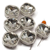 These clear square 2 hole slider beads feature sparkling faceted cut glass in a silver bezel setting. Beautiful rhinestone spacer beads and unique findings for layered necklaces, multi-strand bracelets, and bead weaving. Perfect for beaders and crafters working with SuperDuo, CzechMates, tile beads, and other double hole jewelry components.