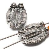 Clear rhinestone oval double hole focal beads with decorative encrusted platinum silver border. These rare 2 hole slider beads are unique findings perfect for bridal jewelry, statement necklaces, and bohemian bracelet designs. Use as bead weaving anchor in peyote or loom projects, or string with seed beads, crystal beads, and semi-precious stone chips around them.