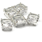 Rare clear resin rhinestone square double hole focal beads in open back platinum silver prong setting. These unique lightweight 2 hole slider beads are hard to find sparkling findings perfect for bridal jewelry, bohemian necklaces, and bead weaving anchor points. Pair with Czech glass, crystal beads, seed beads, and freshwater pearls as supporting components.