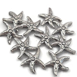 Antique silver starfish double hole focal beads with intricate textured detail and rich aged finish. These rare 2 hole slider beads are perfect for coastal jewelry, beach inspired designs, and bead weaving anchor points in peyote stitch and loom work. Pair with turquoise, hematite, coral, freshwater pearls, and seed beads as supporting components.