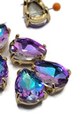 Large Purple Aqua AB rhinestone slider bead in a gold setting featuring a faceted pear-shaped design with brilliant purple, aqua, and turquoise flashes. The two-hole construction keeps strands aligned while creating professional-looking jewelry. Perfect for bracelet making, necklace designs, bead weaving, earrings, pendants, and handmade jewelry projects.