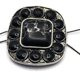 Antique silver 2 Hole Slider Bead featuring a large faux marble center stone with natural-looking white veining and coordinating black accent stones around the perimeter. The rounded square shape creates a distinctive western appearance. Photographed with a dime for size comparison, this focal bead is perfect for bracelet making, necklace designs, leather projects, custom jewelry, and rustic Southwestern-inspired handmade accessories.