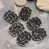 Rectangular 2 Hole Slider Beads featuring glossy black stones set in antique silver metal. The decorative border of oval stones adds dimension and texture while the dual-hole construction supports multi-strand jewelry projects. Photographed with a dime for size comparison, these focal beads are ideal for bracelet making, necklace designs, leather projects, beadwork, and rustic western-inspired handmade jewelry.