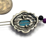 Detailed product photograph of faux turquoise 2 Hole Slider Beads featuring oval stones with natural-looking veining set in ornate antique silver settings. The dual-hole design supports multi-strand jewelry construction while the western styling creates visual impact. Shown with a dime and beading pins for reference, these focal beads are perfect for handcrafted jewelry, necklaces, bracelets, and Southwestern-inspired creations.