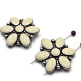 Cream enamel flower focal beads set in antique silver metalwork. The smooth enamel petals create a soft, elegant appearance while the silver accents add texture and vintage character. Displayed with a dime for scale, these dual-hole slider beads work beautifully in handmade bracelets, necklaces, bead weaving, custom jewelry, and romantic floral-inspired accessories.