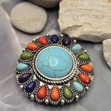 Round 2 Hole Slider Bead with faux turquoise and colorful accent stones arranged in a decorative circular pattern. The vibrant colors create a bold centerpiece while the antique silver setting adds texture and rustic western appeal. Perfect for Bracelet Making, Necklace Designs, custom jewelry, handcrafted accessories, and Southwestern-inspired jewelry collections.