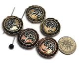 Round Tree of Life 2 Hole Slider Beads featuring raised Eternal Life Tree designs in mixed light antique gold and antique copper finishes. Displayed with a dime and beading pins for size reference, these symbolic focal beads are ideal for handmade bracelets, necklaces, spiritual jewelry, artisan accessories, family-themed designs, and meaningful jewelry making projects.