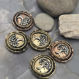 Tree of Life 2 Hole Slider Beads in mixed antique copper and light antique gold finishes. The detailed tree imagery symbolizes strength, growth, family, and connection. Photographed with a dime and beading pins for size reference, these focal beads work beautifully in handmade bracelets, necklaces, spiritual jewelry, and meaningful artisan accessories.