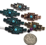 Mixed metal geometric focal beads with turquoise-look center stones surrounded by decorative floral accents and textured western details. The bold angular shape creates eye-catching centerpiece components for jewelry designs. Photographed with a dime for size reference, these dual-hole slider beads work beautifully in bracelet making, necklace designs, artisan jewelry collections, leather accessories, handcrafted western fashion, and rustic jewelry projects.