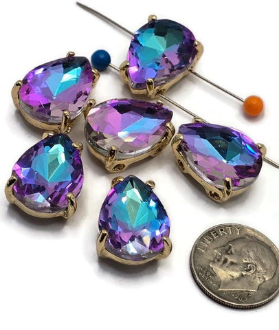 Purple Aqua AB rhinestone 2 hole slider bead in a gold setting featuring a large faceted pear-shaped stone with vibrant purple, aqua blue, and teal color shifts. Decorative focal bead for bracelet making, necklace designs, bead weaving, and handmade jewelry projects.