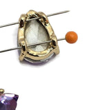 Sparkling Purple Aqua AB 2 hole slider bead featuring a large faceted teardrop rhinestone set in gold metal. The stone displays beautiful color shifts ranging from purple and lavender to aqua blue and teal. A versatile focal bead for handmade bracelets, necklaces, earrings, bead woven designs, and professional jewelry projects.
