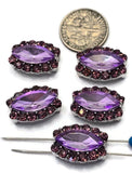 Beautiful marquise-shaped 2 Hole Slider Beads featuring faceted violet center stones surrounded by sparkling light amethyst rhinestones in silver-tone settings. Five focal beads are displayed on a white background beside a dime for size reference and a beading pin threaded through one bead. These dual-hole slider beads are ideal for handmade bracelets, necklaces, earrings, pendants, and multi-strand jewelry designs that require sparkle and elegant purple color.