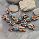 Decorative arrow focal beads featuring faux turquoise center stones framed by detailed antique copper metalwork. The elongated arrow shape creates visual interest while the dual-hole construction supports multi-strand jewelry projects. Perfect for handmade bracelets, western necklaces, leather jewelry, custom accessories, and Southwestern-inspired artisan jewelry creations.