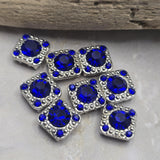 Bring rich Sapphire Blue color to your handmade jewelry with these elegant 2 Hole Slider Beads. The sparkling rhinestones and antique silver finish create a decorative focal element that works beautifully in bracelet making, necklace designs, and multi-strand jewelry. Their dual-hole construction provides stability and design flexibility, making them suitable for leather jewelry, bead weaving projects, custom earrings, pendants, and artisan jewelry collections.