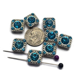 These sparkling Aquamarine 2 Hole Slider Beads offer endless possibilities for handmade jewelry. The platinum silver finish enhances the brilliance of the aqua-blue rhinestones while providing a clean and versatile look. Use them as focal beads in bracelets, necklaces, pendants, earrings, leather jewelry, and multi-strand jewelry designs. They also integrate beautifully into bead weaving, Peyote Stitch, and loom work projects requiring decorative jewelry components.