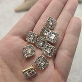 Create elegant handmade jewelry with these Clear Rhinestone Slider Beads. The bright gold finish enhances the brilliance of the faceted center stone and coordinating accent rhinestones, creating beautiful focal points for bracelet making and necklace designs. Their two-hole design allows easy incorporation into bead weaving, loom work, Peyote Stitch, leather jewelry, and multi-strand jewelry projects.