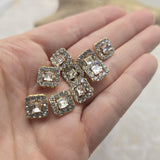 Bring classic sparkle to your jewelry creations with these Clear Rhinestone 2 Hole Slider Beads. The faceted center rhinestone catches the light beautifully while the surrounding accent stones add additional brilliance and dimension. Finished in bright gold, these focal beads are ideal for bracelets, necklaces, leather jewelry, earrings, pendants, and multi-strand jewelry projects