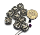 These beautiful Clear Slider Beads feature sparkling faceted rhinestones surrounded by coordinating accent stones in a bright platinum silver setting. Their elegant square design creates eye-catching focal points for bracelets, necklaces, pendants, earrings, and custom handmade jewelry. The two-hole construction provides stability for multi-strand jewelry, bead weaving, and artisan jewelry projects while adding classic sparkle and dimension to finished designs.