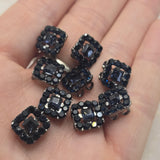 The deep black sparkle of these Jet Rhinestone Slider Beads brings bold style and elegance to handmade jewelry projects. Finished in gun metal and designed with two holes for stringing, they are perfect for bracelets, necklaces, pendants, earrings, and bead weaving. Their versatile neutral coloring makes them easy to coordinate with countless jewelry making supplies and creative design combinations.