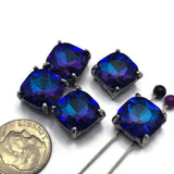 Bring rich color and dramatic sparkle to your jewelry collection with these Royal Blue and Amethyst Glass Stone 2 Hole Slider Beads. The dark gun metal finish complements the vibrant blue and purple tones while the dual-hole design provides stability for bracelets, necklaces, pendants, and bead weaving projects. These large focal beads are perfect for creating statement jewelry and one-of-a-kind artisan designs.