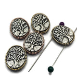These beautiful Tree of Life Slider Beads feature detailed branch and root designs highlighted by contrasting antique silver backgrounds. The antique brass and antique copper borders create a warm rustic appearance that works beautifully in bracelets, necklaces, pendants, and earrings. Their two-hole design provides stability for multi-strand jewelry, bead weaving, Peyote Stitch, and artisan jewelry projects while adding symbolic meaning to handmade creations.