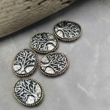 Create nature-inspired handmade jewelry with these Tree of Life 2 Hole Slider Beads. The intricate raised tree design represents wisdom, growth, and family connections while the antique brass and copper finishes add vintage-inspired charm. Perfect for bracelet making, necklace designs, leather jewelry, pendants, and custom jewelry projects, these focal beads provide both beauty and symbolism within finished jewelry designs.