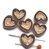 Add warmth and vintage charm to your handmade jewelry with these Heart 2 Hole Slider Beads. Featuring a bright copper finish with antique detailing, these decorative focal beads showcase a raised textured heart surrounded by ornate scrollwork. Perfect for bracelet making, necklace designs, earrings, pendants, and multi-strand jewelry, their dual-hole construction provides stability while adding romantic style to artisan jewelry and custom handmade creations.