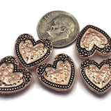 Create heartfelt jewelry designs with these decorative Heart 2 Hole Slider Beads. The bright copper finish with antique detailing highlights the raised heart design, creating beautiful focal beads for bracelet making, necklace designs, leather jewelry, and artisan accessories. Their dual-hole construction offers excellent stability for multi-strand jewelry, Peyote Stitch, Loom Work, and other creative jewelry-making techniques while adding warmth and vintage-inspired style.