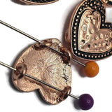 These elegant Heart 2 Hole Slider Beads combine romantic styling with practical design. The bright copper finish with antique detailing enhances the raised heart centerpiece while adding depth and character to every bead. Ideal for bracelet making, necklace designs, earrings, pendants, and multi-strand jewelry, these focal beads also work beautifully in bead weaving, custom jewelry, and meaningful handmade gifts for special occasions.