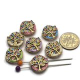 These decorative Tree of Life 2 Hole Slider Beads combine a bright gold finish with colorful enamel leaves to create eye-catching focal beads for handmade jewelry. Designed for bracelet making, necklace designs, pendants, earrings, and multi-strand jewelry, their two-hole construction keeps strands evenly aligned while adding artistic detail. Perfect for nature-inspired, artisan, bohemian, and meaningful jewelry collections.