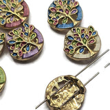 Designed to inspire beautiful handmade jewelry, these Tree of Life 2 Hole Slider Beads feature a bright gold finish with vibrant enamel detailing in a variety of soft colors. Their dual-hole design makes them excellent focal beads for bracelet making, necklace designs, bead weaving, and custom jewelry. The timeless Tree of Life symbolizes strength, growth, and new beginnings, making every finished piece especially meaningful.