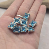 Featuring vibrant Aquamarine rhinestones and decorative platinum silver detailing, these 2 Hole Slider Beads bring elegance and color to handmade jewelry. Their compact square shape and dual-hole design make them ideal for bracelets, necklaces, pendants, earrings, and leather jewelry. Jewelry makers will appreciate their versatility in Peyote Stitch, loom work, bead weaving, and multi-strand jewelry projects where decorative focal beads help create stunning finished pieces.