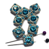 These Aquamarine Rhinestone 2 Hole Slider Beads combine brilliant color with timeless platinum silver styling. The sparkling aqua-blue rhinestones create eye-catching focal points in bracelet making, necklace designs, earrings, pendants, and leather jewelry. Their dual-hole design allows for easy incorporation into bead weaving, Peyote Stitch, loom work, and multi-strand jewelry projects. A versatile addition to any collection of jewelry making supplies and jewelry components.