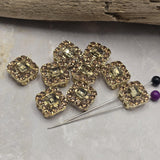 Featuring sparkling Light Colorado Topaz rhinestones and bright gold metal, these 2 Hole Slider Beads create stunning focal points for handmade jewelry. Their dual-hole design allows easy integration into bracelets, necklaces, leather jewelry, and multi-strand jewelry projects. The warm neutral color works beautifully with pearls, seed beads, and gold findings, making these decorative slider beads valuable additions to any collection of jewelry findings and jewelry components.