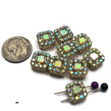 These decorative Rhinestone Slider Beads feature sparkling Clear AB stones set within detailed bright gold frames. Their versatile design makes them ideal focal beads for bracelets, necklaces, earrings, pendants, and matching jewelry sets. The dual-hole construction allows easy incorporation into multi-strand jewelry and bead weaving projects while adding sparkle, dimension, and elegance to your favorite handmade jewelry designs.