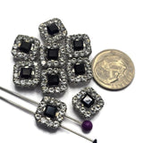 Create stunning handmade jewelry with these Jet and Clear CZ 2 Hole Slider Beads. The faceted black center stone contrasts beautifully against the sparkling Clear CZ border, creating eye-catching focal beads with timeless appeal. Finished in platinum silver, they are ideal for bracelet making, necklace designs, bead weaving, leather jewelry, and custom jewelry projects. Their versatile styling complements contemporary, classic, and vintage-inspired jewelry designs.
