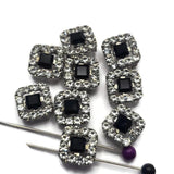 These elegant Jet and Clear CZ Rhinestone Slider Beads combine classic black-and-white styling with exceptional sparkle. The platinum silver finish complements both the dark center rhinestone and the surrounding clear stones, creating versatile focal beads for bracelet making, necklace designs, artisan jewelry, and custom accessories. Their two-hole design makes them ideal for bead weaving, multi-strand jewelry, and handmade jewelry projects requiring decorative jewelry components.