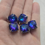 Add bold color and sparkle to your jewelry designs with these Royal Blue and Amethyst Glass Stone 2 Hole Slider Beads. Set in a dark gun metal finish, these large focal beads display beautiful flashes of cobalt blue and rich violet tones. Perfect for bracelet making, necklace designs, pendants, and multi-strand jewelry, their dual-hole construction also makes them ideal for bead weaving, artisan jewelry, and custom handmade creations.