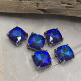 These striking 2 Hole Slider Beads feature faceted Royal Blue and Amethyst glass stones secured within elegant gun metal prong settings. The vibrant color combination creates eye-catching focal points for bracelets, necklaces, earrings, and pendants. Their larger size and dual-hole design make them excellent choices for statement jewelry, multi-strand jewelry, bead weaving projects, and custom artisan accessories requiring dramatic color and sparkle.